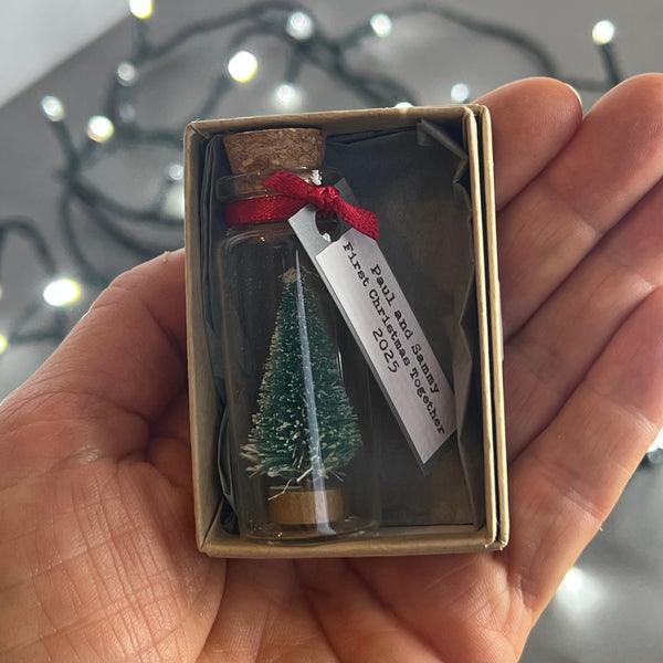 Personalised Miniature Christmas Tree In A Glass Bottle Keepsake With Grey Tag