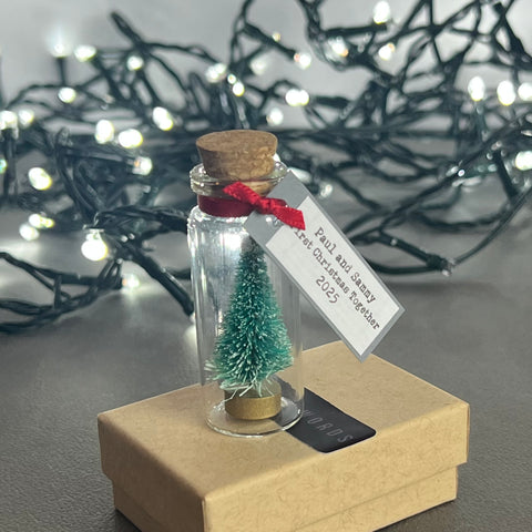Personalised Miniature Christmas Tree In A Glass Bottle Keepsake With Grey Tag
