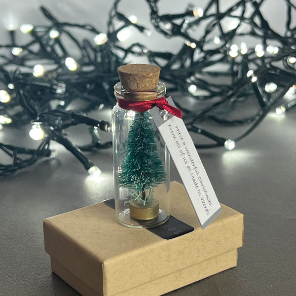 Personalised Miniature Christmas Tree In A Glass Bottle Keepsake With Grey Tag