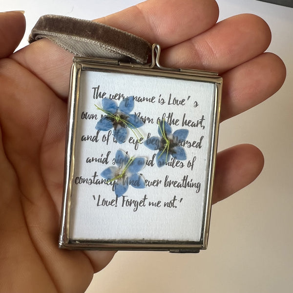 Hand-stitched forget-me-not flowers on white laid paper for personalised gift