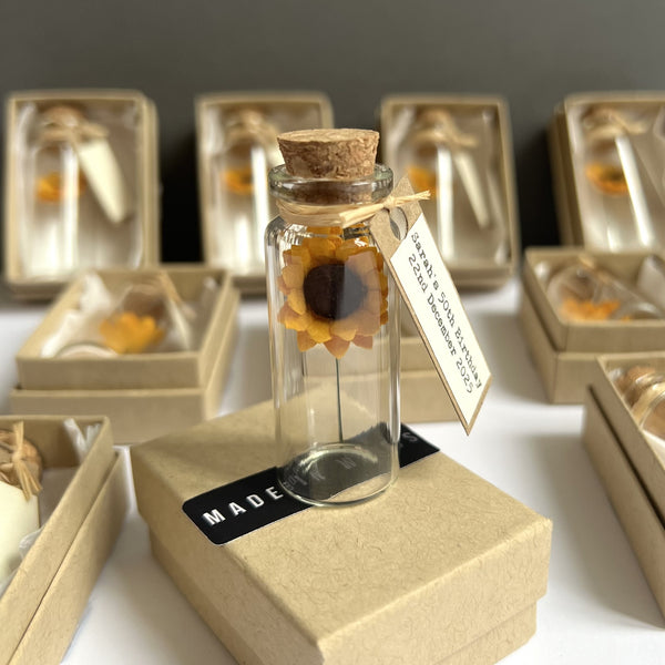 Sunflowers in a bottle wedding favour, party gift, or remembrance keepsake, available in sets of 10, 25 or 50