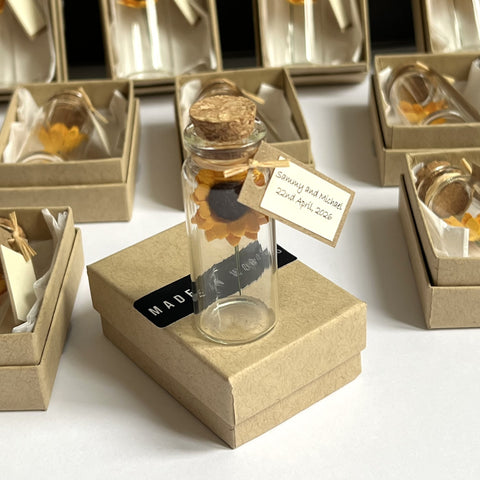 Sunflowers in a bottle wedding favour, party gift, or remembrance keepsake, available in sets of 10, 25 or 50