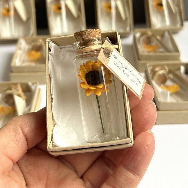 Sunflowers in a bottle wedding favour, party gift, or remembrance keepsake, available in sets of 10, 25 or 50